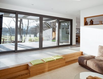 The Schüco LivIngSlide plastic system offers a single frame design for windows and patio doors - The new Schüco LivIngSlide sliding-lift system connects the interior of the house with the outdoor terrace.